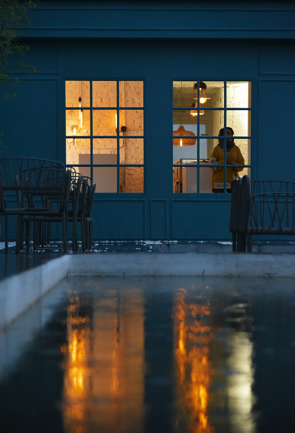 a person standing in front of a building at night