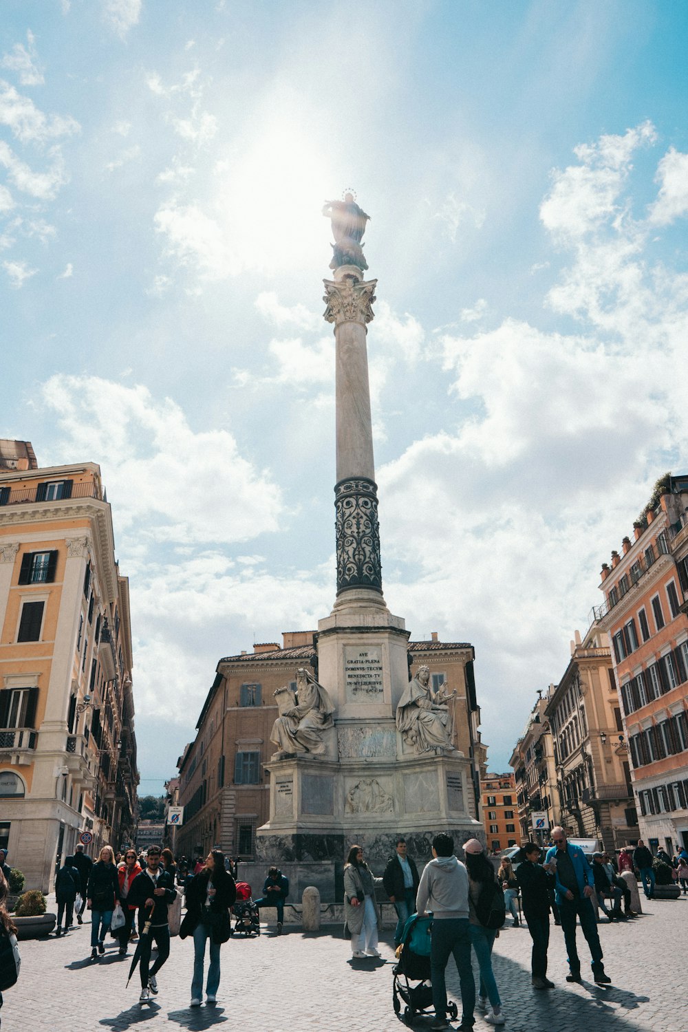 a group of people standing around a monument