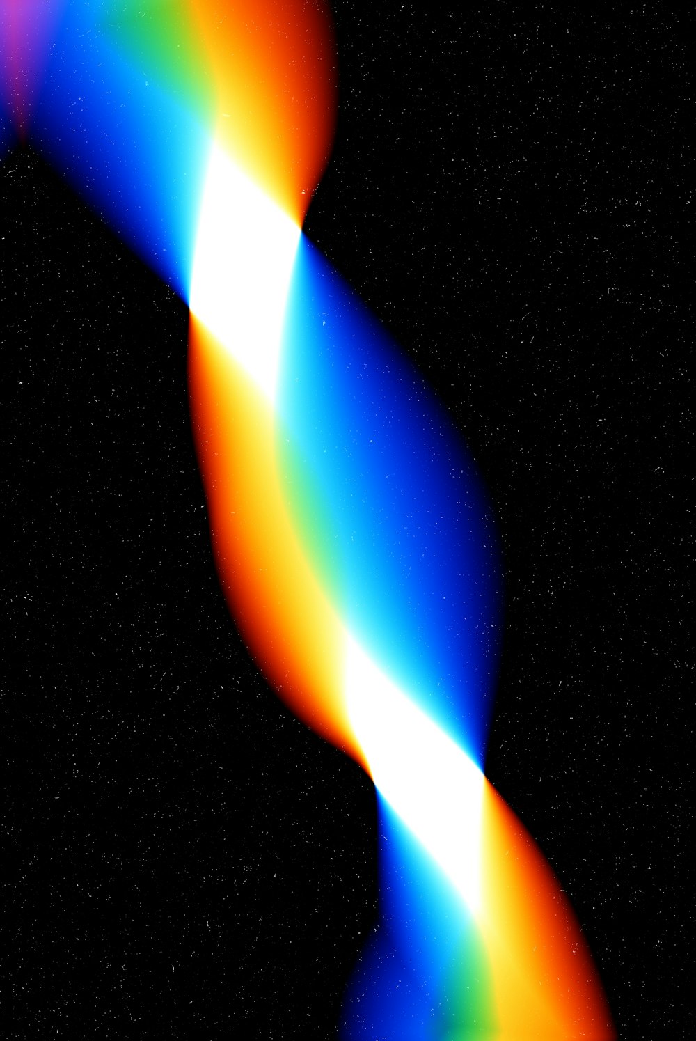 a very colorful object in the dark sky