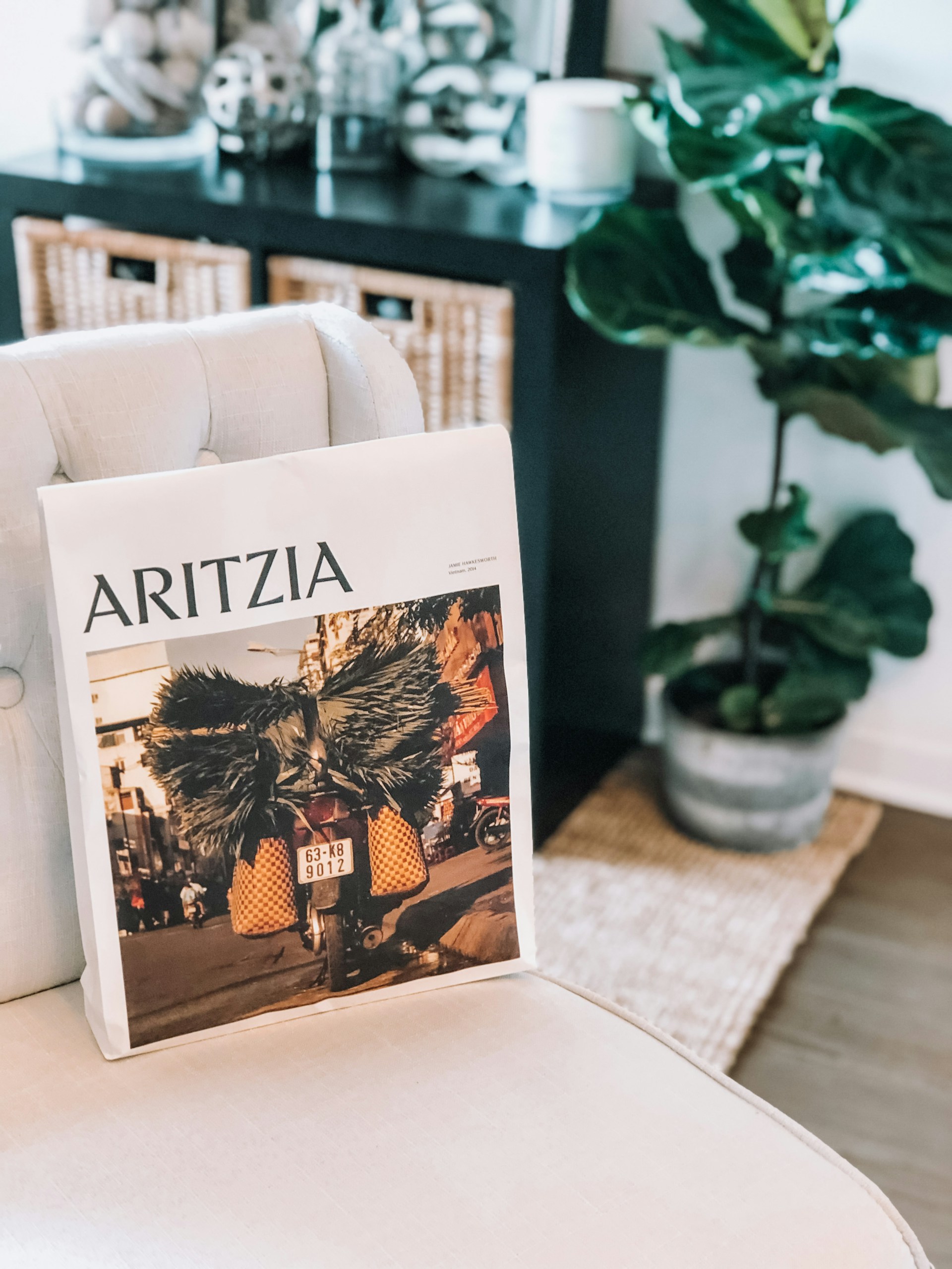 a magazine sitting on top of a white chair