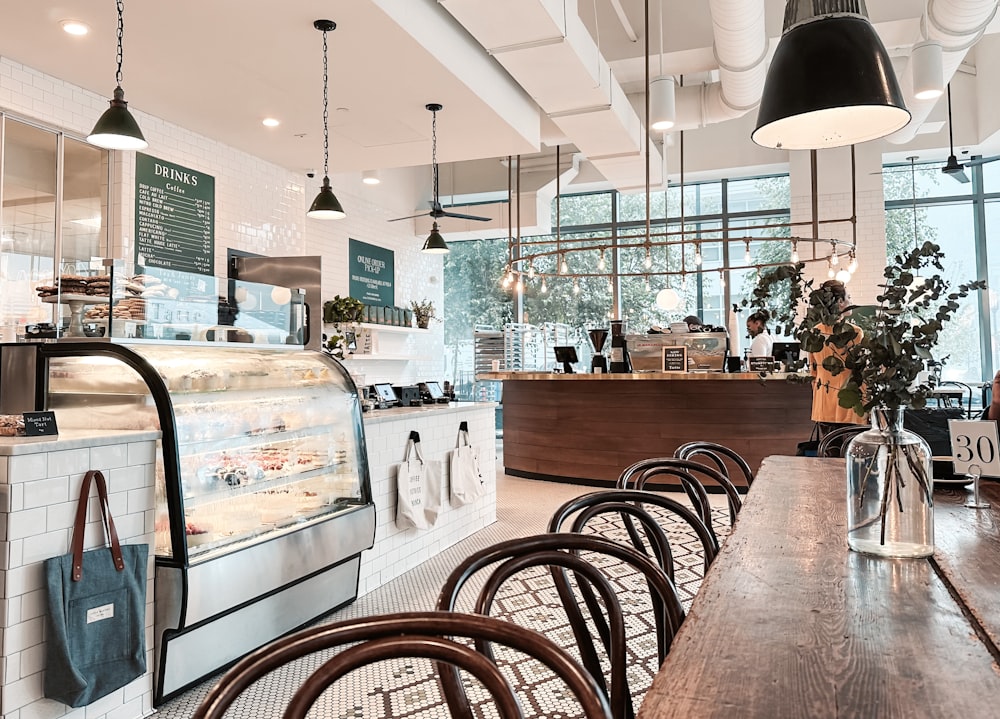 a restaurant with tables and chairs and a counter