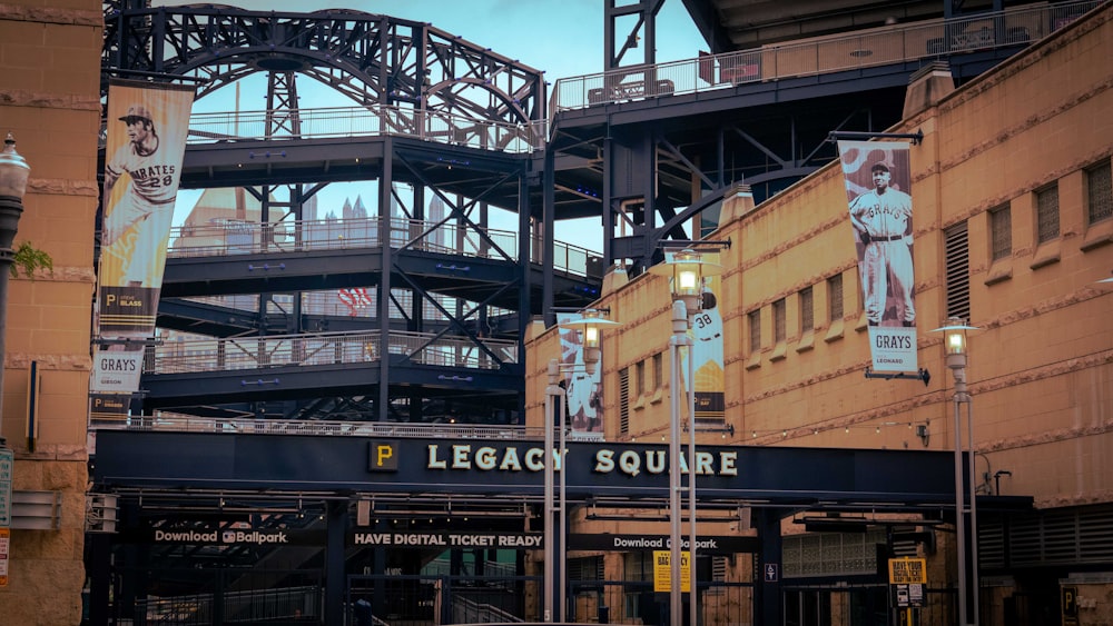 a baseball stadium with a bridge in the background