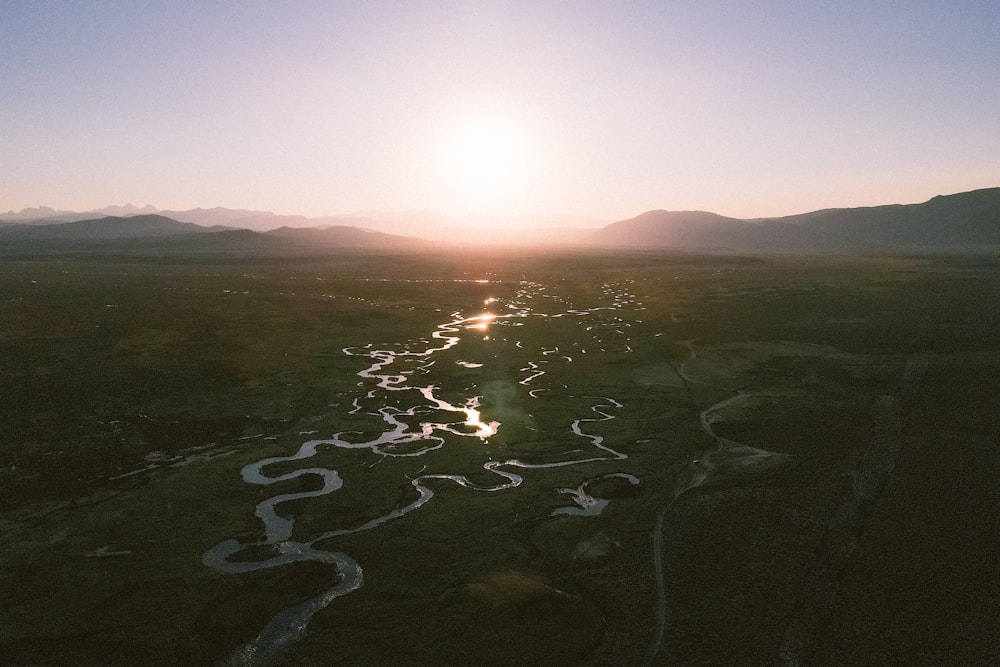 a river running through a lush green field