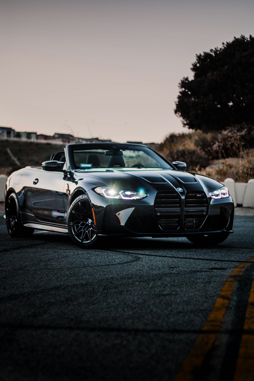 a black sports car parked on the side of the road