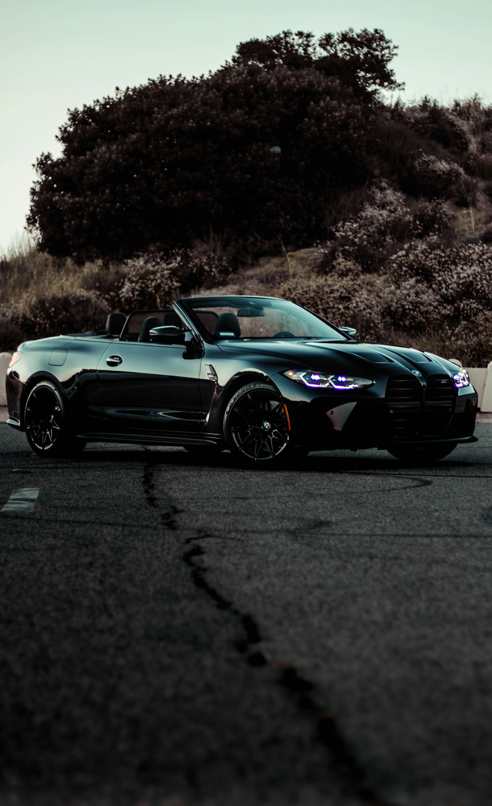 a black sports car parked on the side of the road