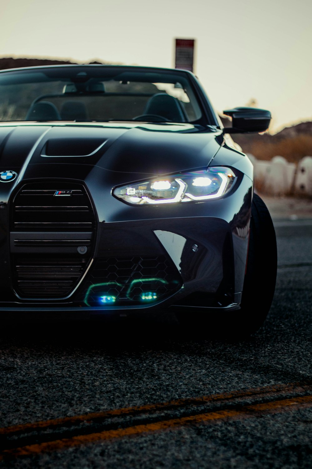 a black sports car parked on the side of the road