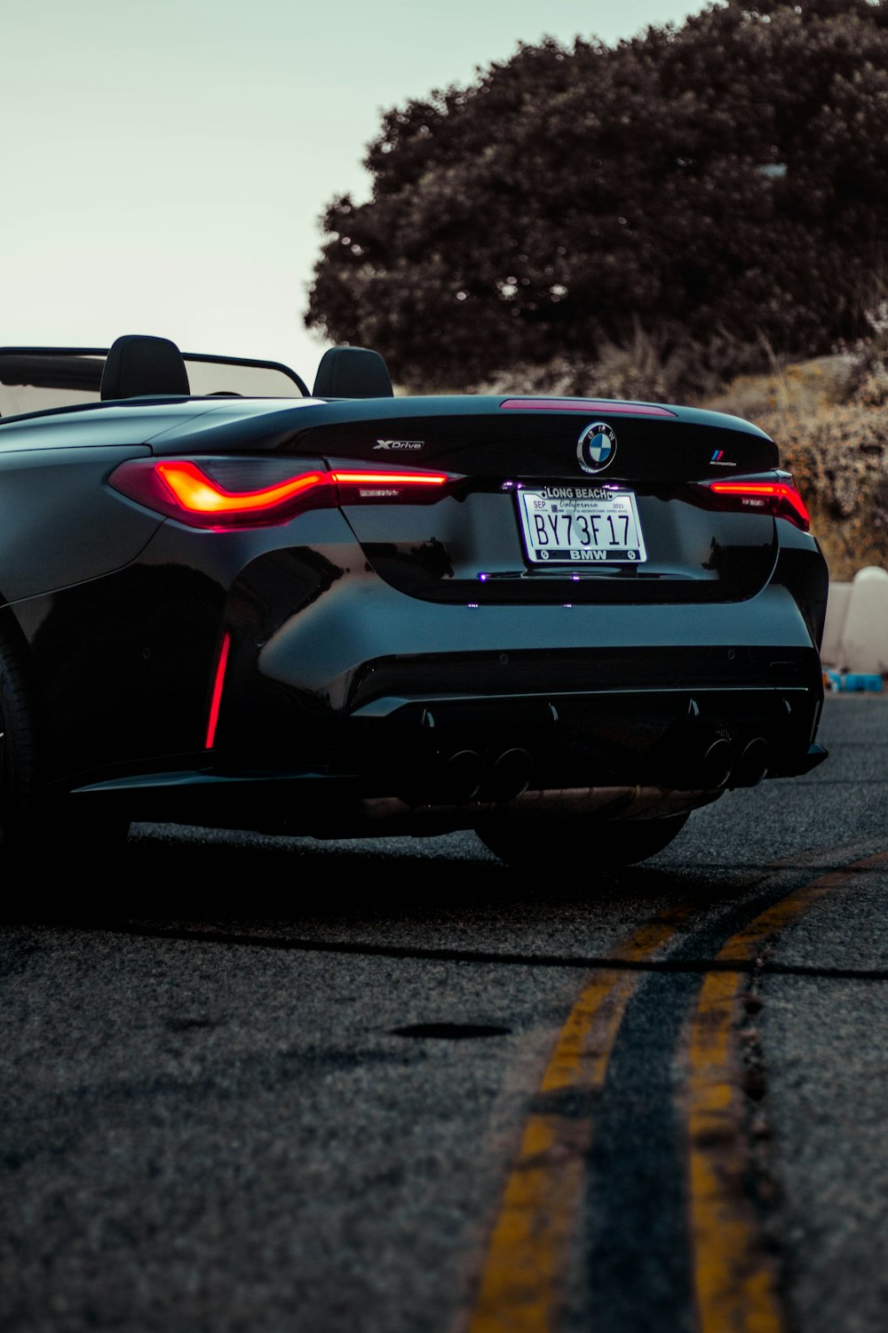 a black sports car parked on the side of the road