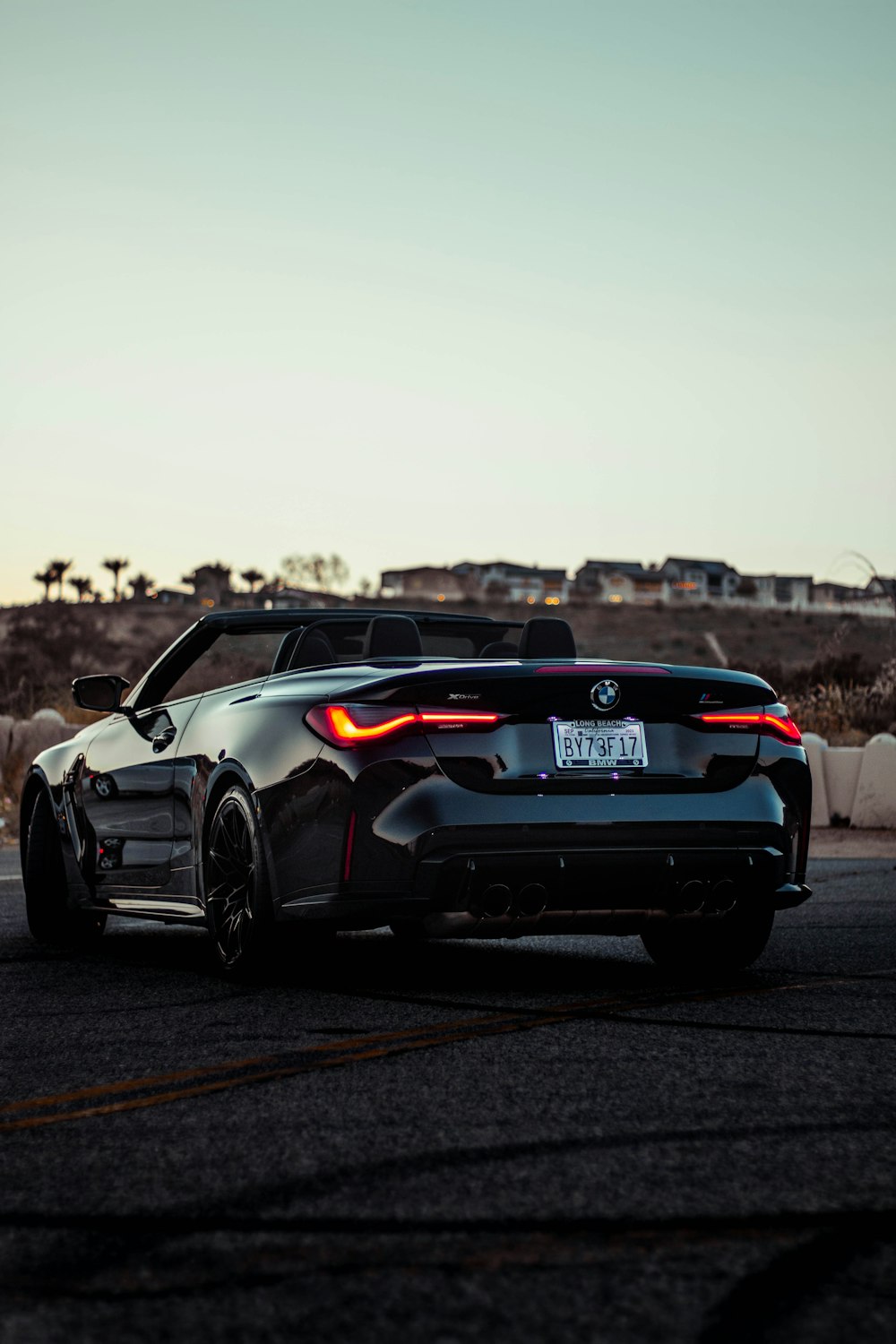 a black sports car parked in a parking lot