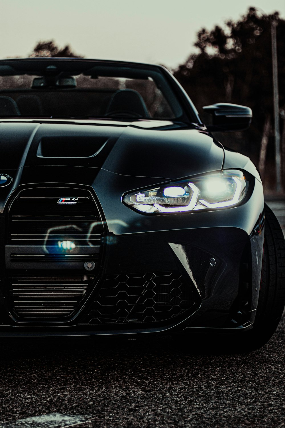 a black sports car parked on the side of the road