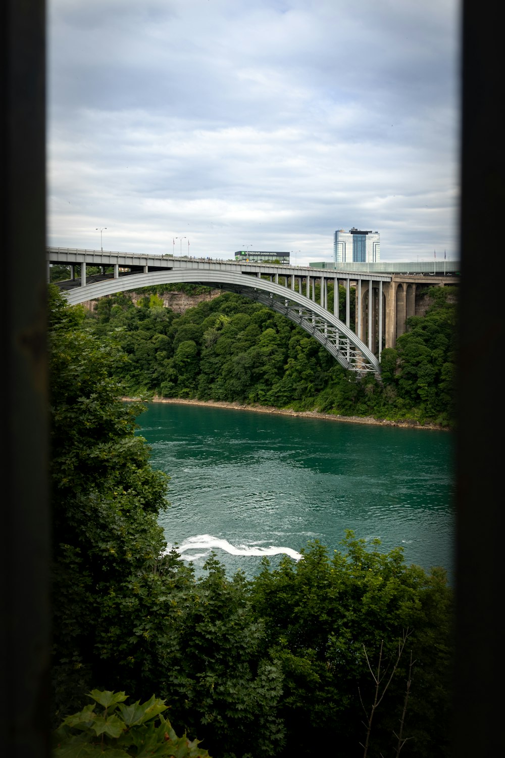 a view of a bridge over a body of water