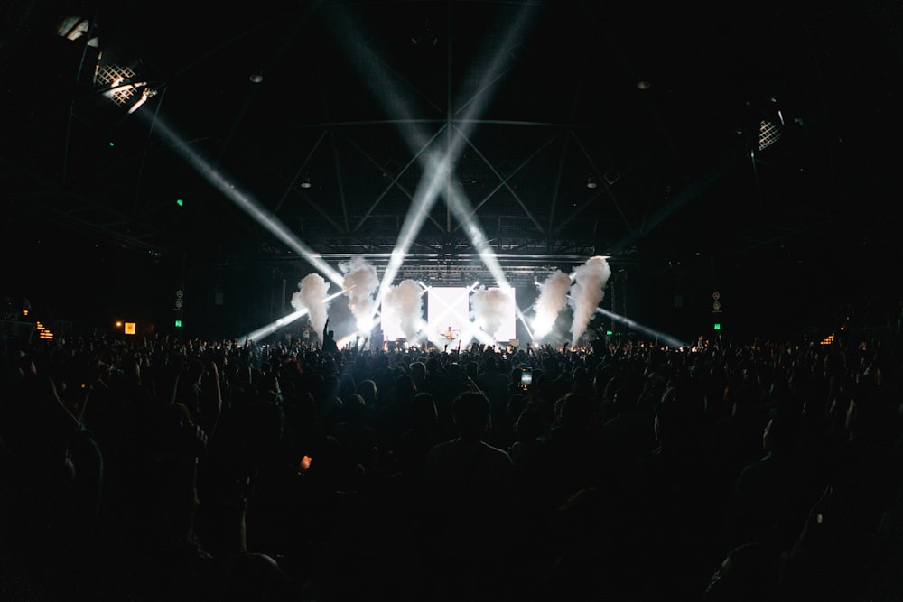 a group of people standing on top of a stage