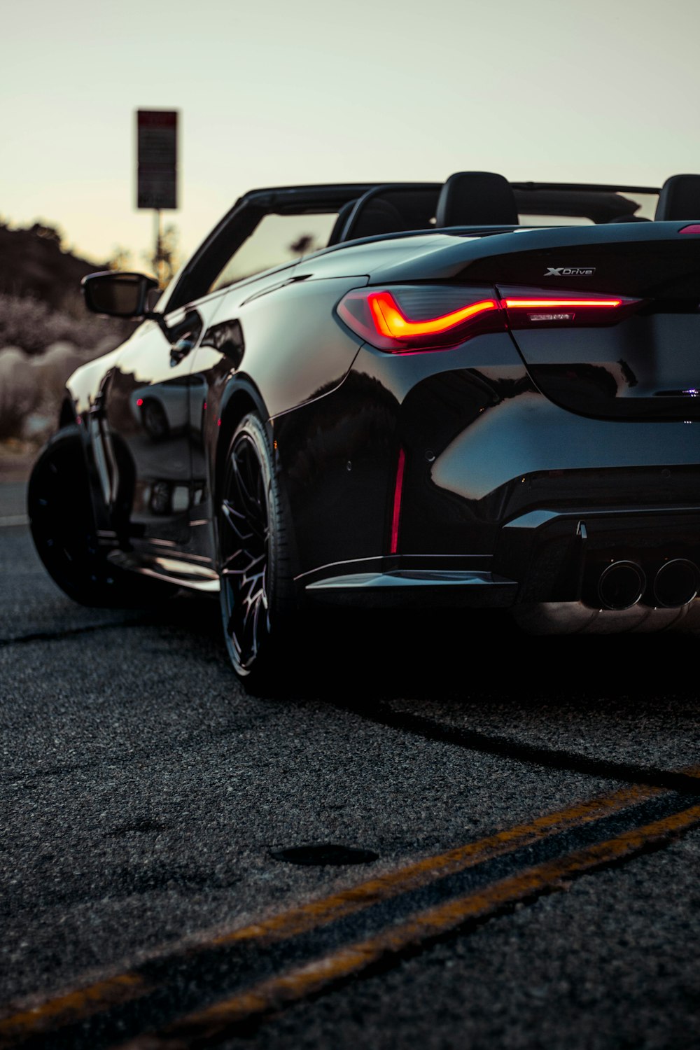 a black sports car parked on the side of the road