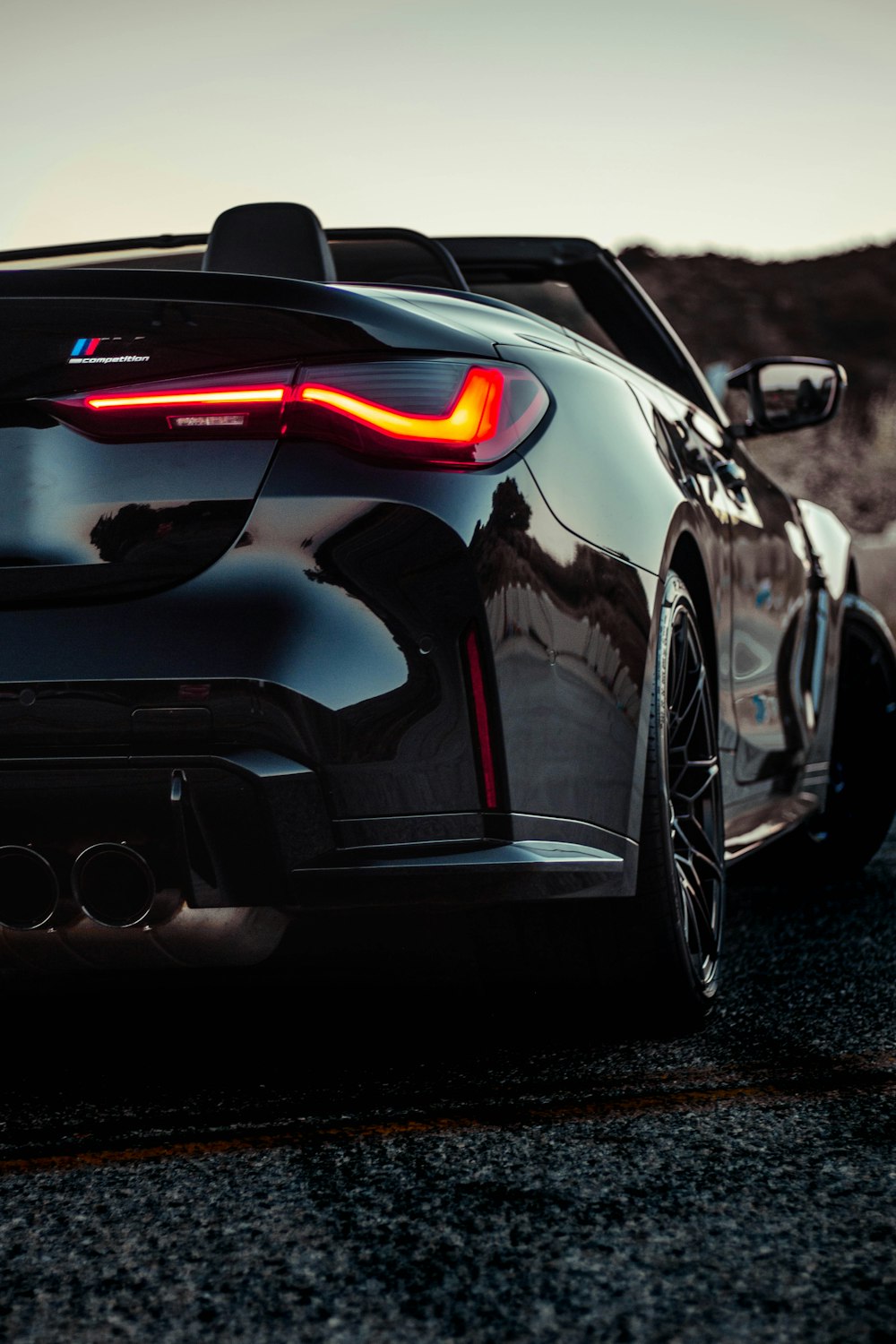 a black sports car parked on the side of the road