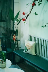 A cozy corner decorated with a mix of plastic floral arrangements from Red Fern Floral Co.