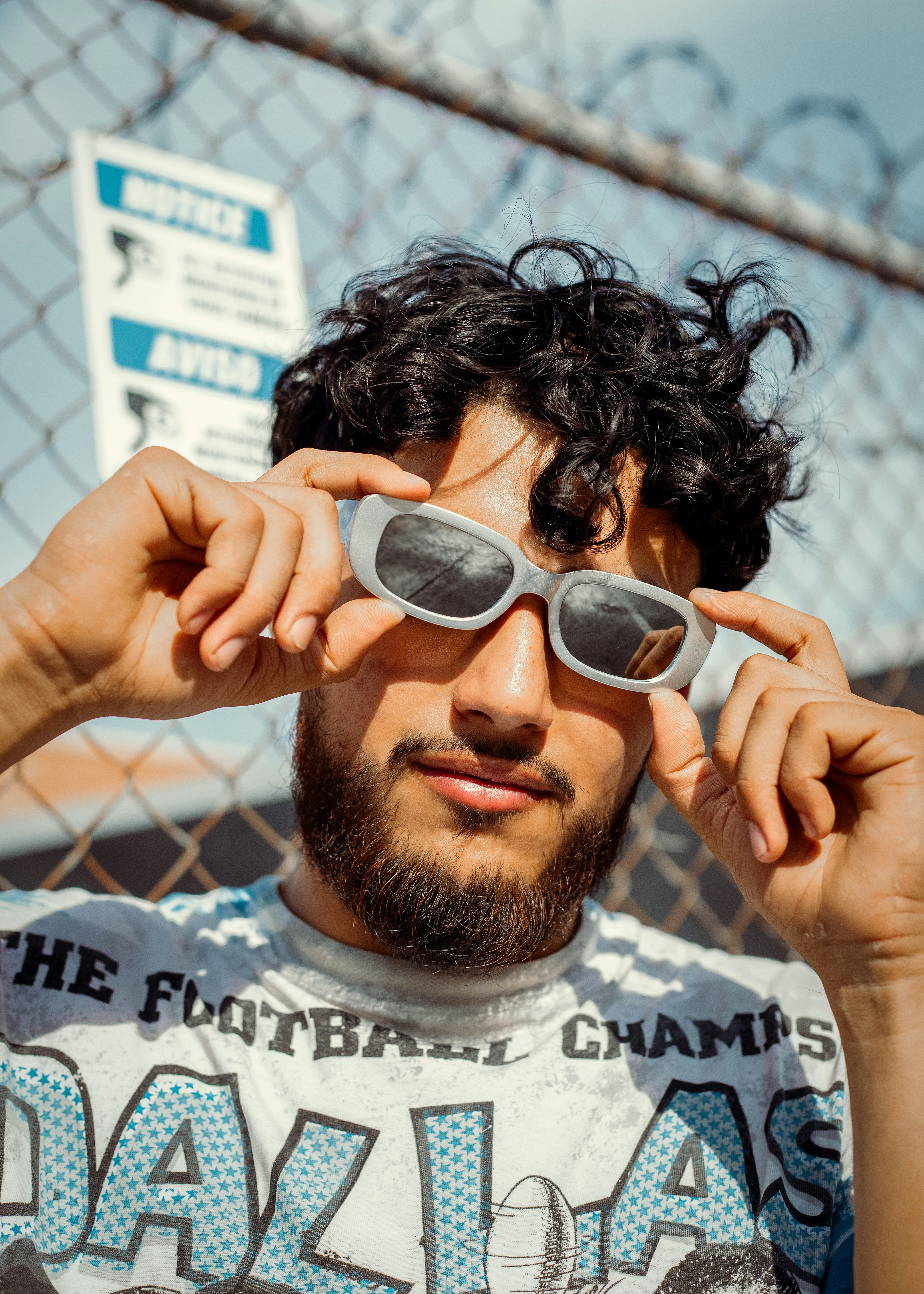 a man with a beard wearing sunglasses