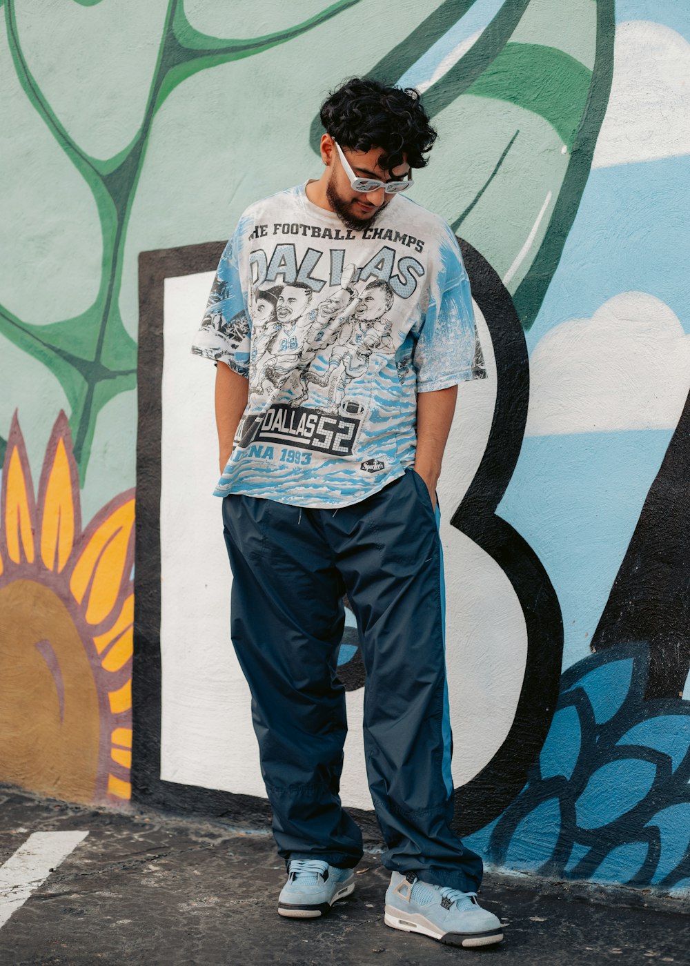 a man standing in front of a colorful wall