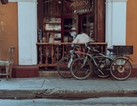 A cozy corner of the hotel lobby with bikes parked neatly and guests chatting.