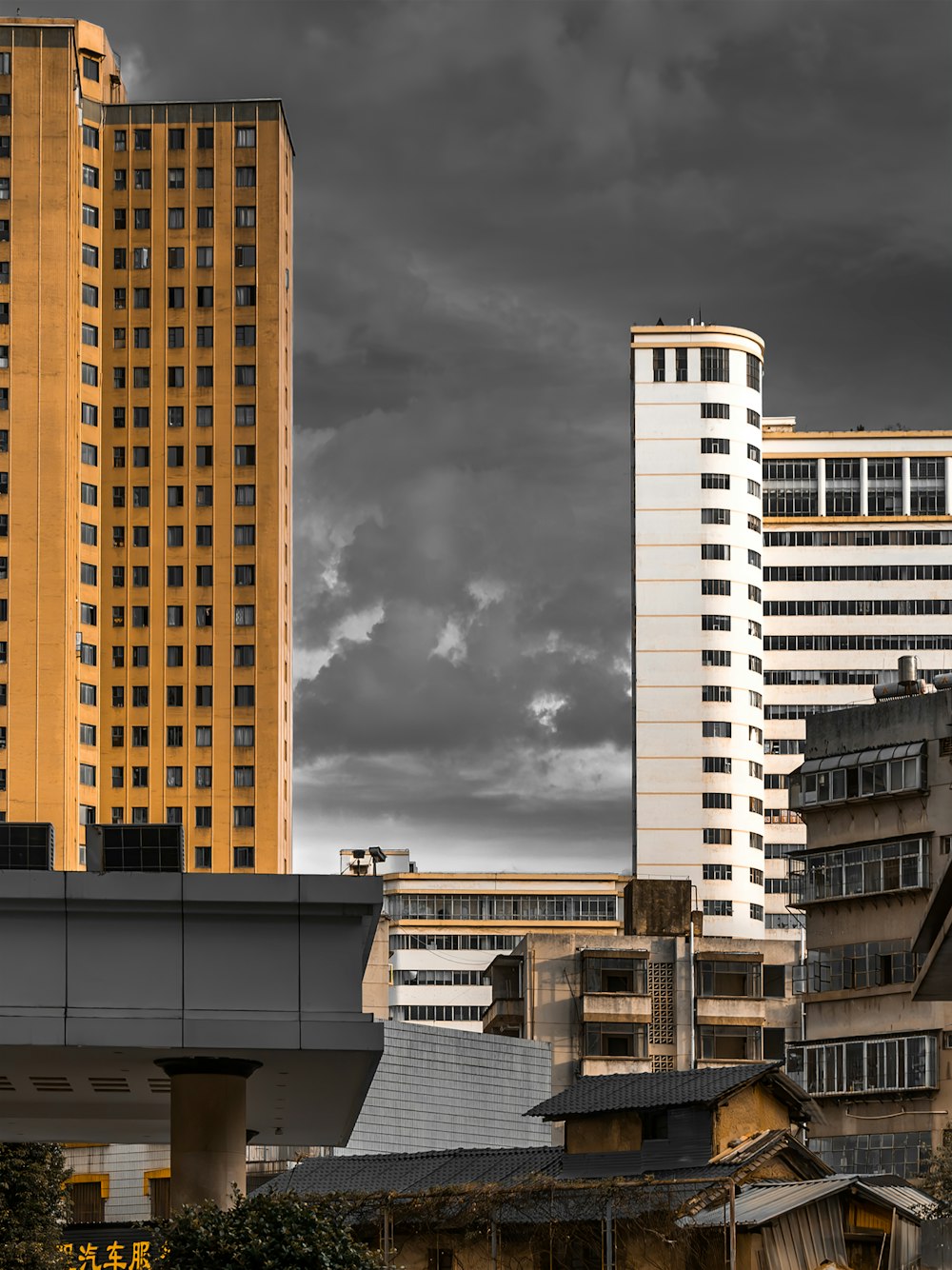 a black and white photo of a city with tall buildings