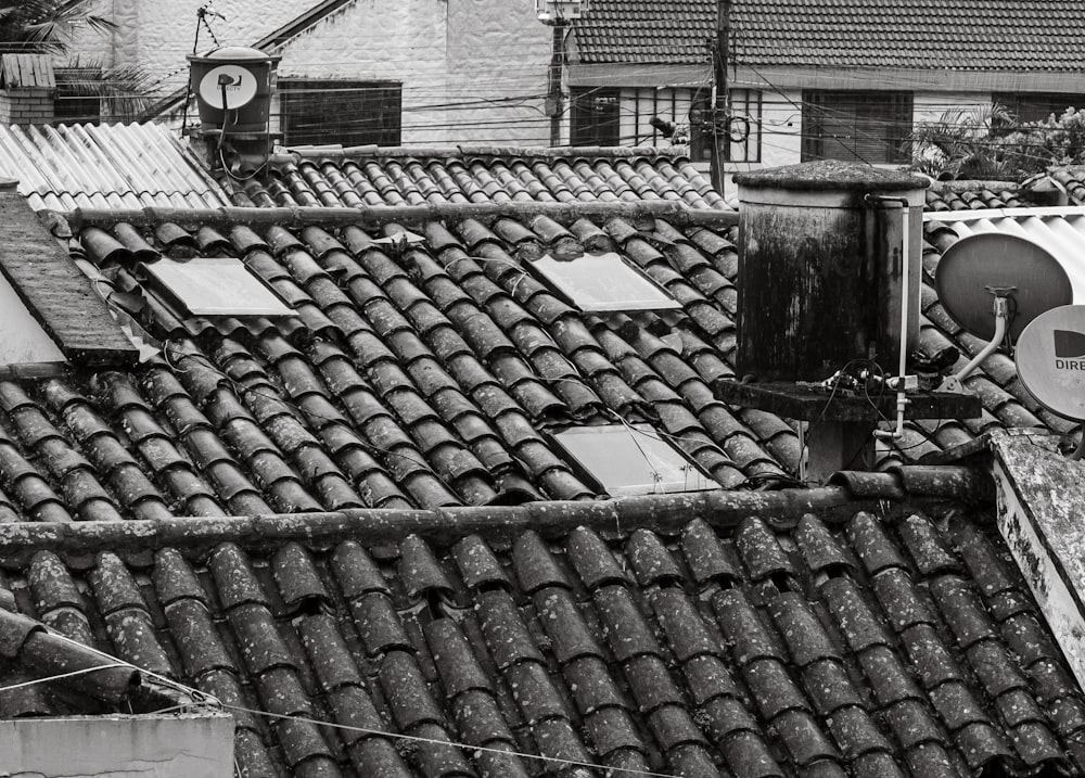 a black and white photo of rooftops and roofs