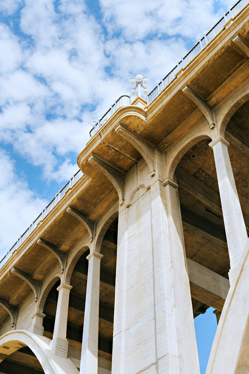 a very tall bridge with some pillars under it