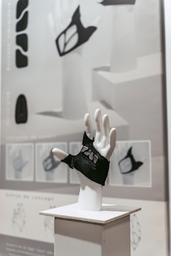 An artist sketching glove designs alongside high-performance materials.