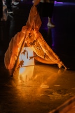 Close-up of the inflatable airframe structure of a float tent glowing softly in the twilight.