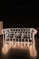 A glowing 3D wireframe model of a website interface with glassmorphism effects, highlighting our web development expertise.