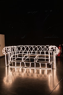 A glowing 3D wireframe model of a website interface with glassmorphism effects, highlighting our web development expertise.