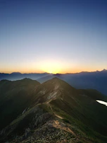 A stunning sunset over the mountains of a remote hiking trail in Patagonia.