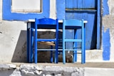 a couple of blue chairs sitting next to each other