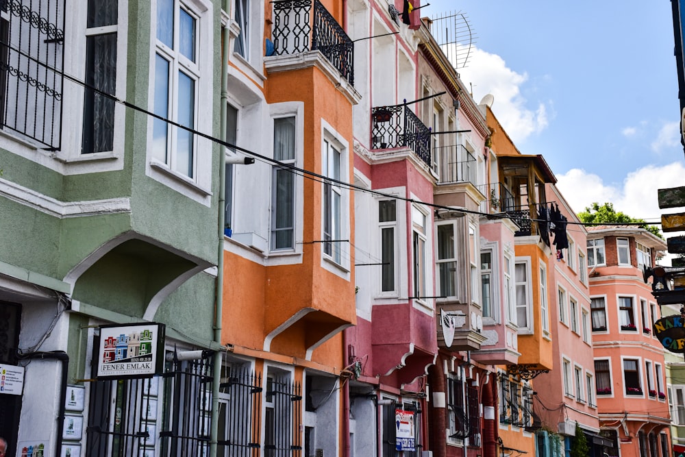 a row of multicolored buildings on a city street