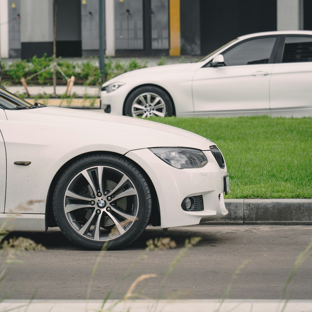 a white car parked on the side of the road