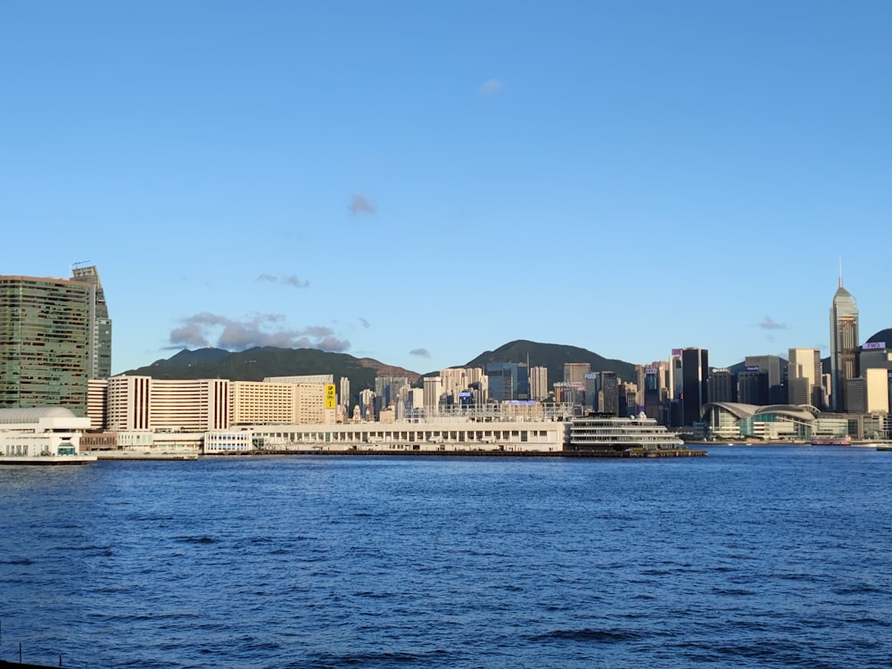 a large body of water with a city in the background