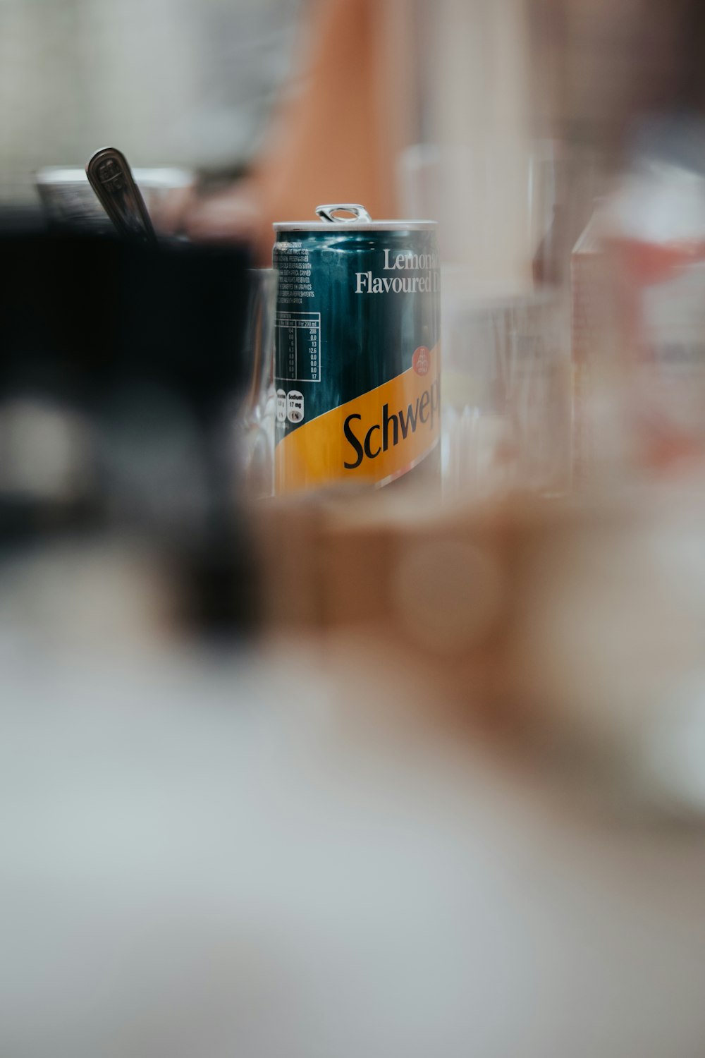 a can of beer sitting on top of a counter