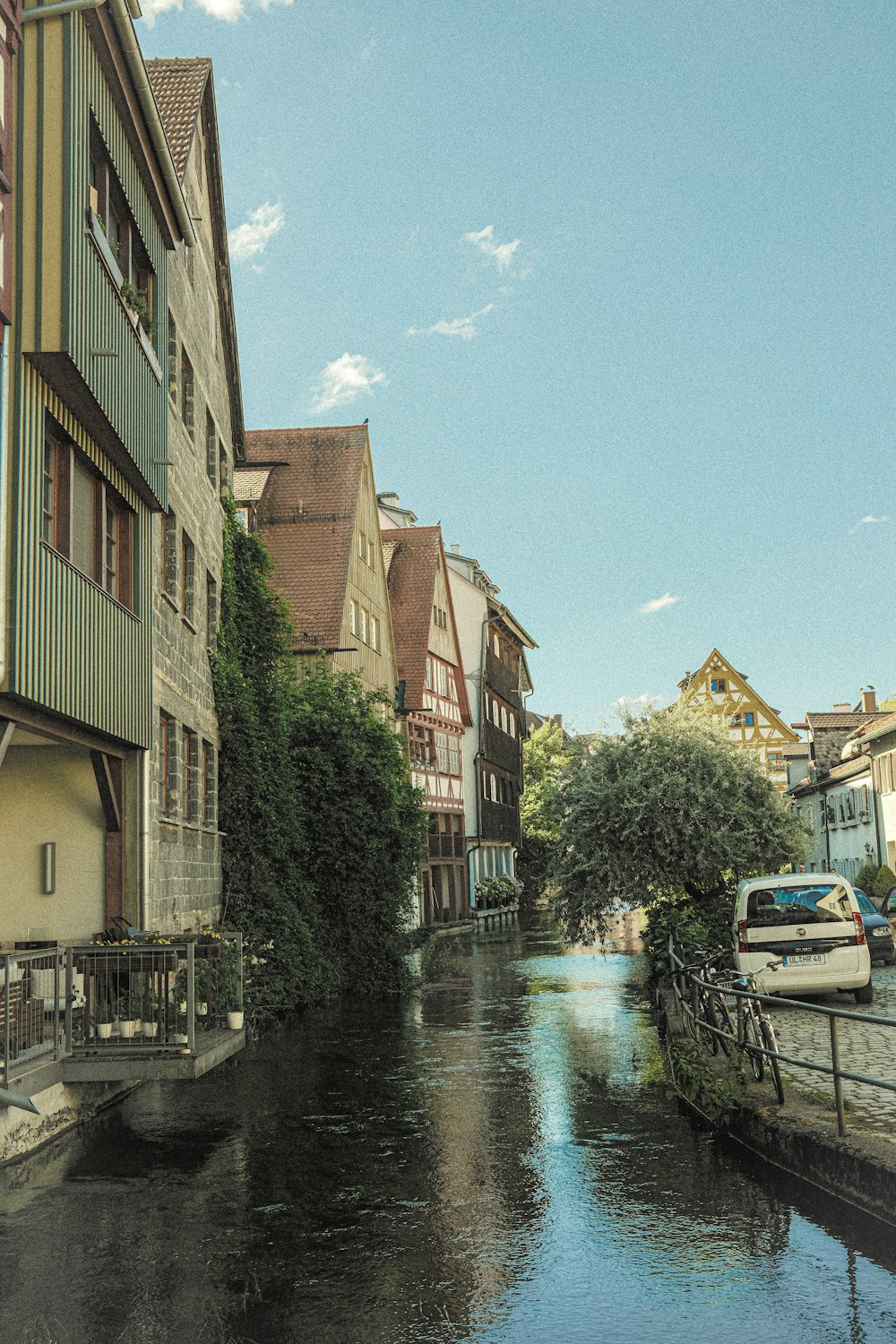 a river running through a city next to tall buildings