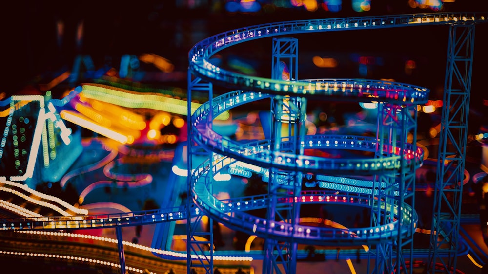 a roller coaster at a carnival at night