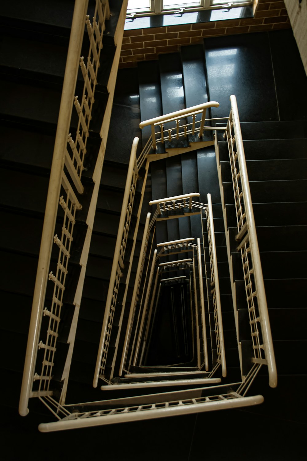 a spiral staircase made of metal and wood