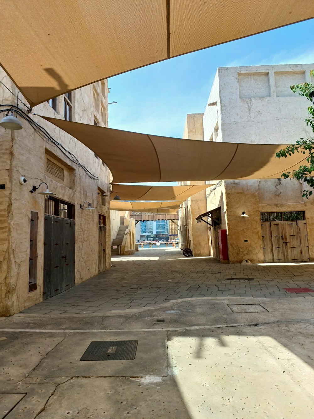 an empty alley with a canopy over it