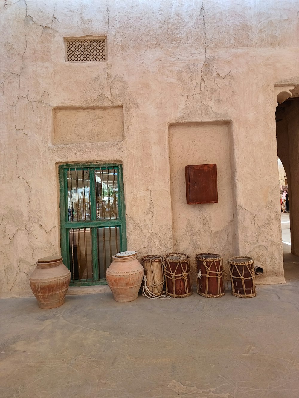 a group of pots sitting in front of a building