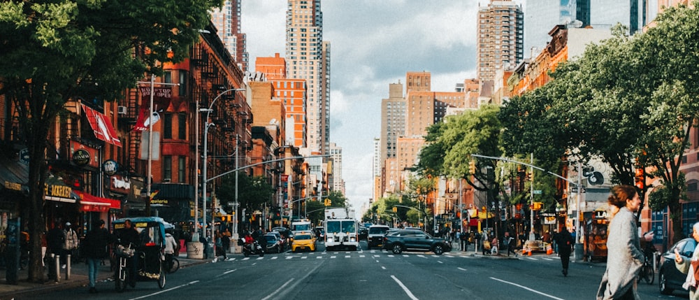 a city street filled with lots of tall buildings