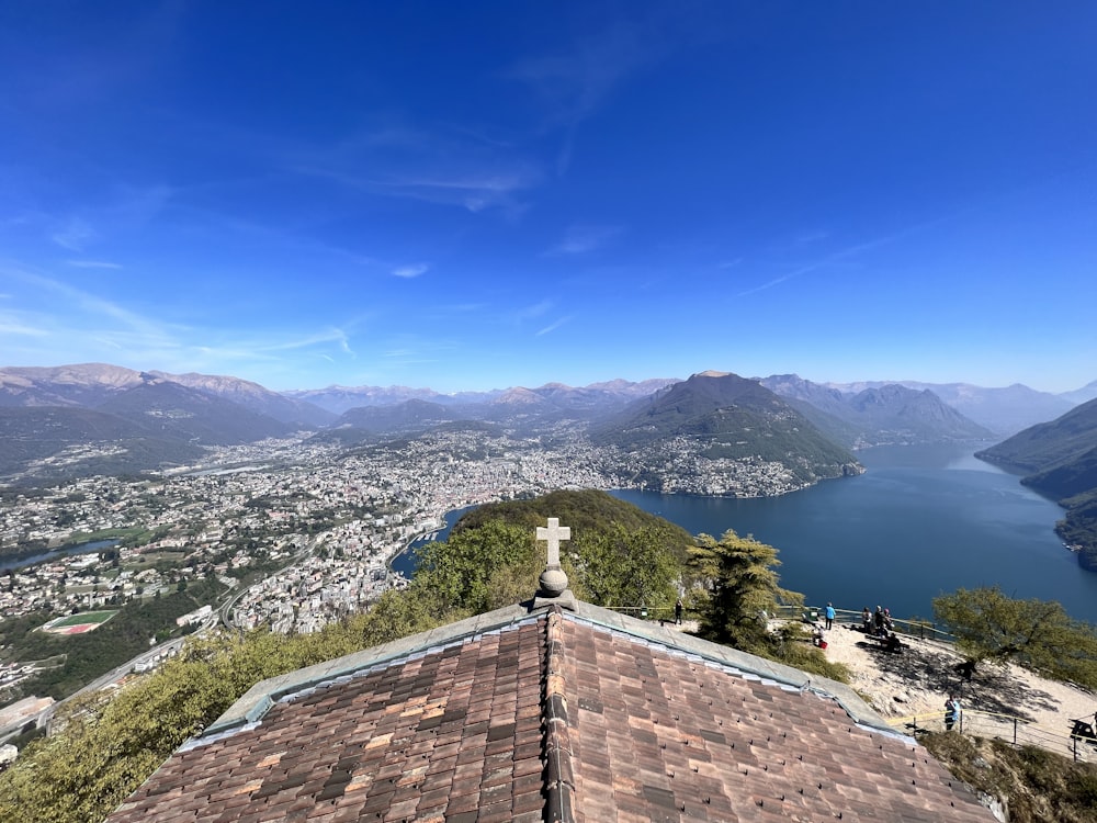 a view of a lake and mountains from the top of a building