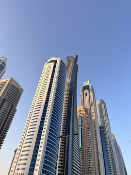 a group of tall buildings in a city