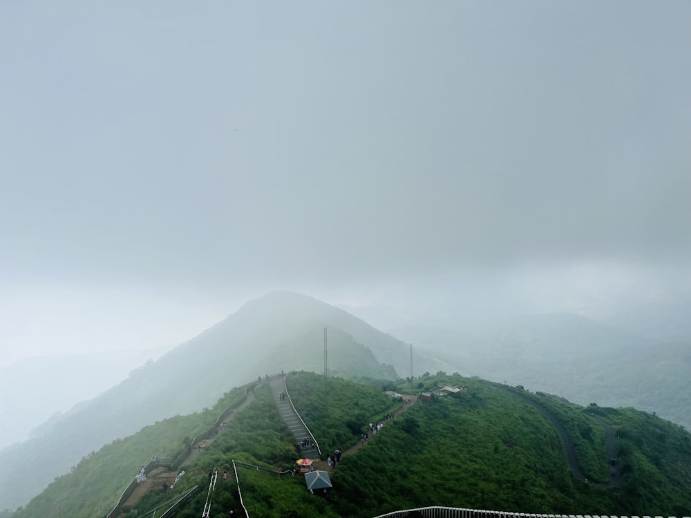 a view of the top of a mountain on a cloudy day