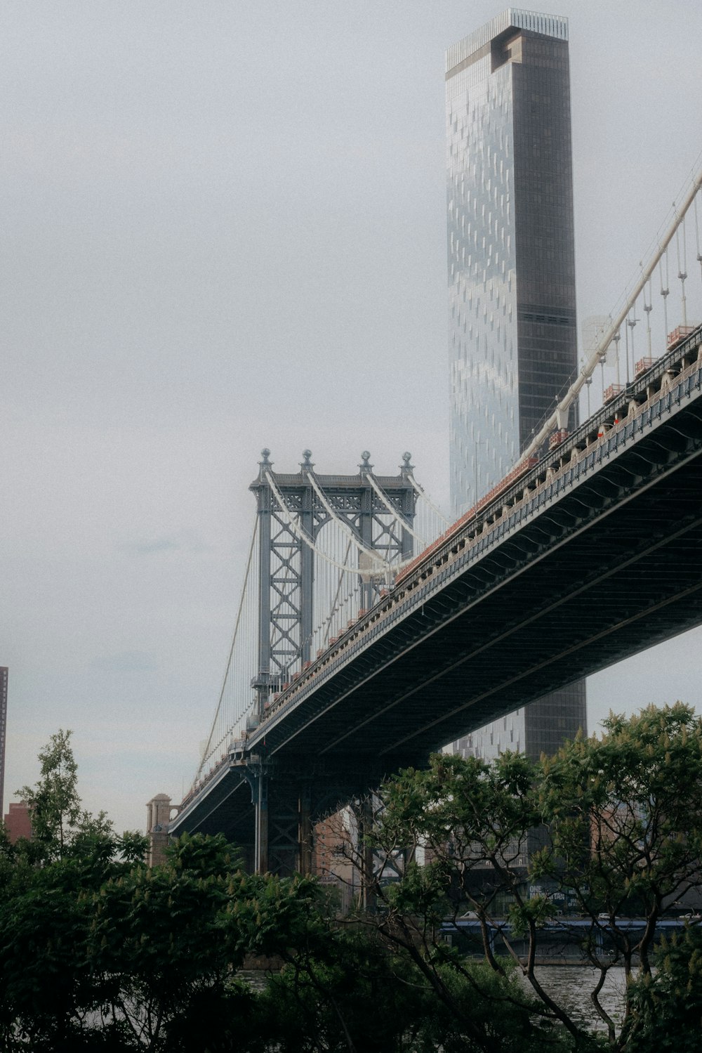 a bridge with a tall building in the background