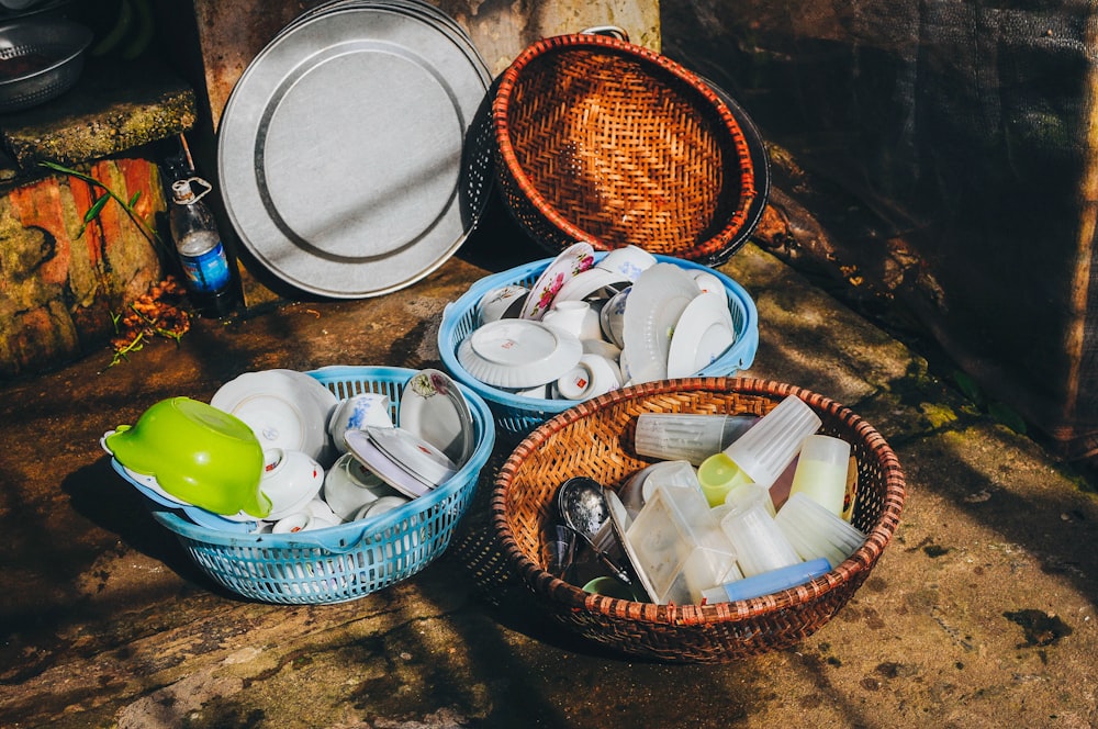 three baskets filled with food sitting on top of a wooden table