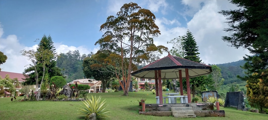 a gazebo sitting in the middle of a lush green park, The garden side of Samadi Maranatha Retreat Centre