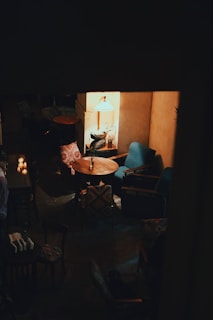 A cozy corner with elegant poltronas and ambient lighting.