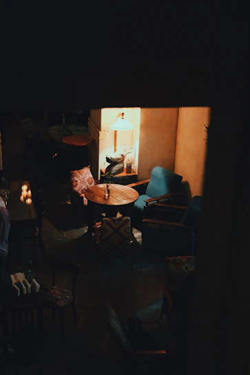 A cozy, softly lit West London venue with comfortable seating and calming decor.