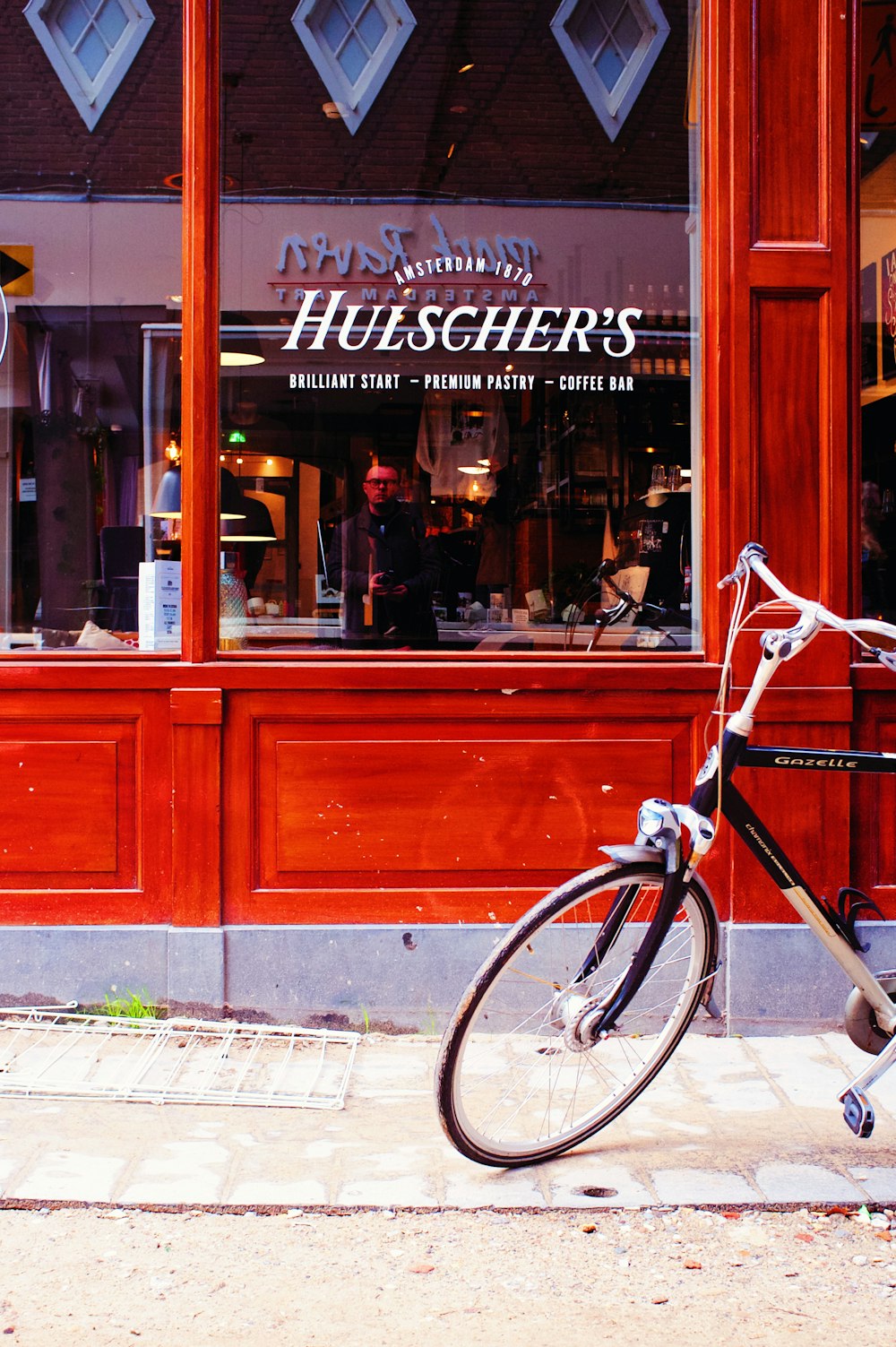 a bicycle parked outside of a store front