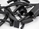 Close-up of industrial rubber components arranged on a workbench.